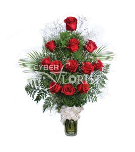 arrangement of roses with greenery